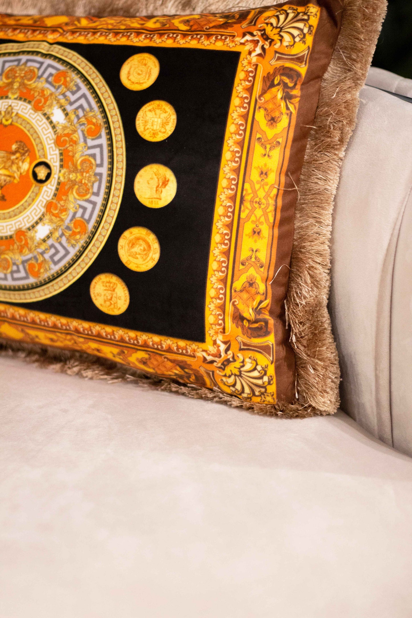 Decorative pillow with gold accents