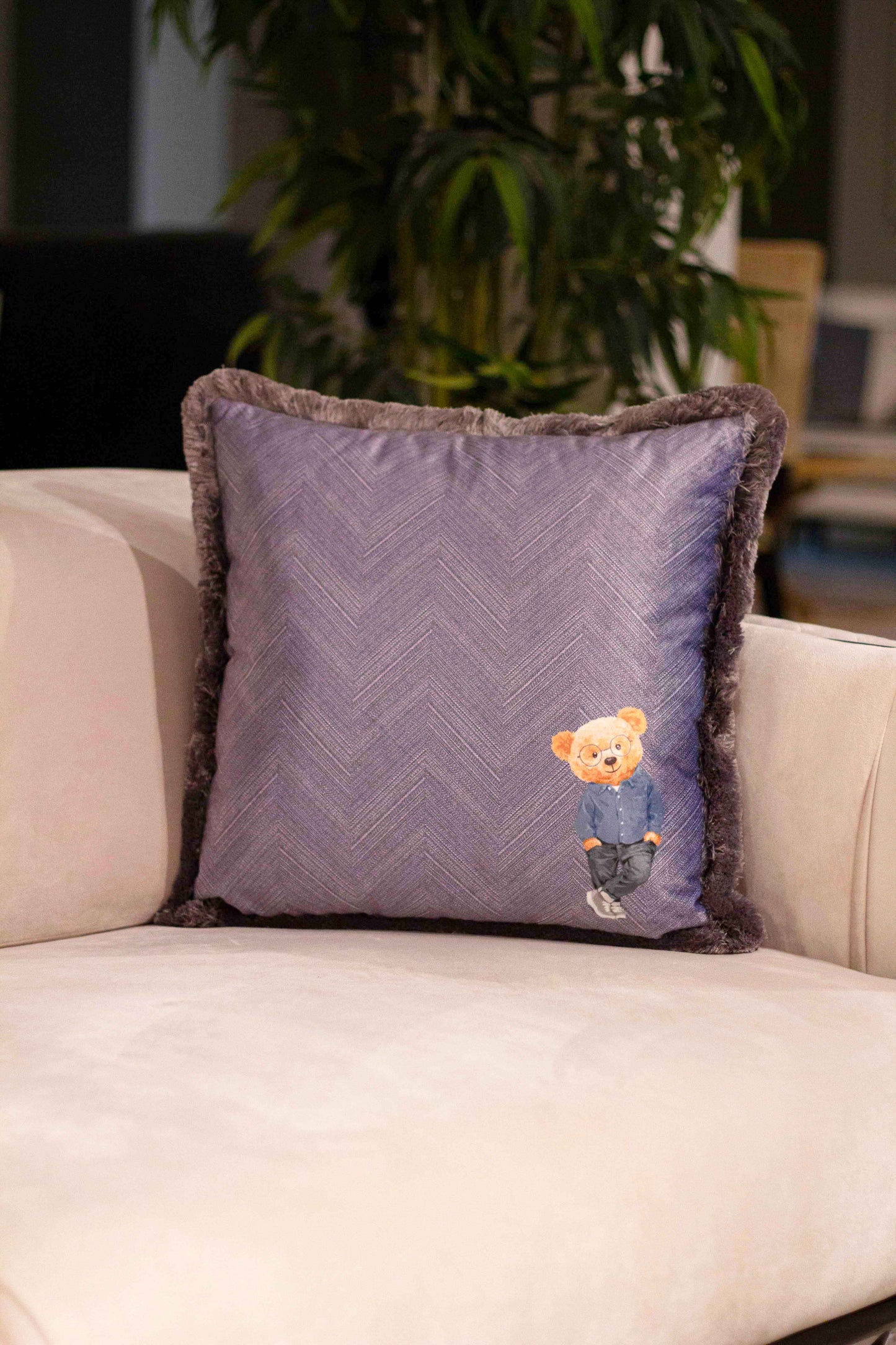 Herringbone decorative pillow with teddy bear motif